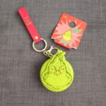 Llavero, espejo y cepillo de mano Grinch