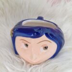 Taza Coraline